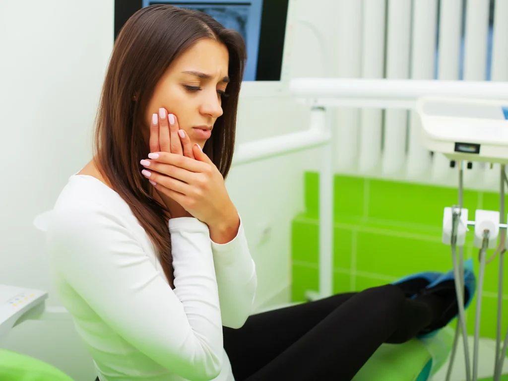 girl at dentist in pain | emergency dentist Worcester, MA