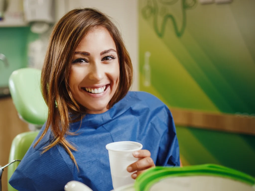Woman smiling in the dental chair | Root canal Worcester, MA